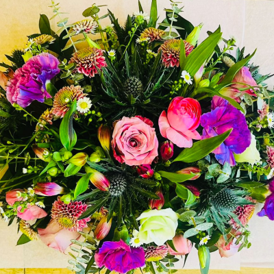 Blooming Harmony - An enchanting bouquet that blends pink and purple hues to create a harmonious and elegant arrangement. Ideal for any special event or as a thoughtful gift, this bouquet brings together the beauty of various seasonal flowers in a captivating display.